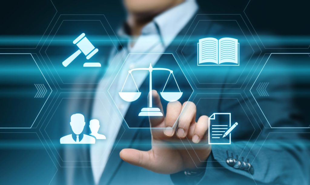 A person in a suit touches a virtual screen displaying icons of legal symbols, reflecting the expertise of an employment litigation attorney NYC in handling complex workplace disputes.