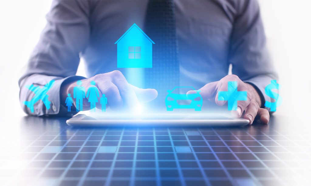 A person in business attire uses a tablet, with insurance-related digital icons for home, car, health, family, and money hovering above—highlighting the expertise of an insurance litigation lawyer NYC in protecting valuable assets.